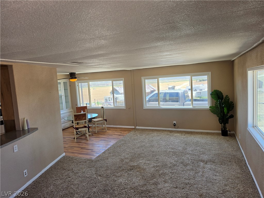 2930 Frehner Ranch Road Pioche, NV 89043 - Photo 39 of 39 A spacious living area with large windows offers sweeping views of the surrounding landscape.