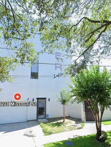 a front view of a house with street