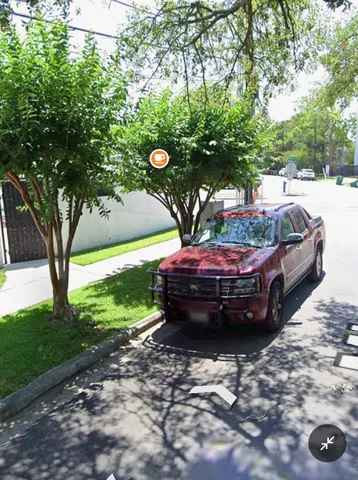 a view of yard with car parked