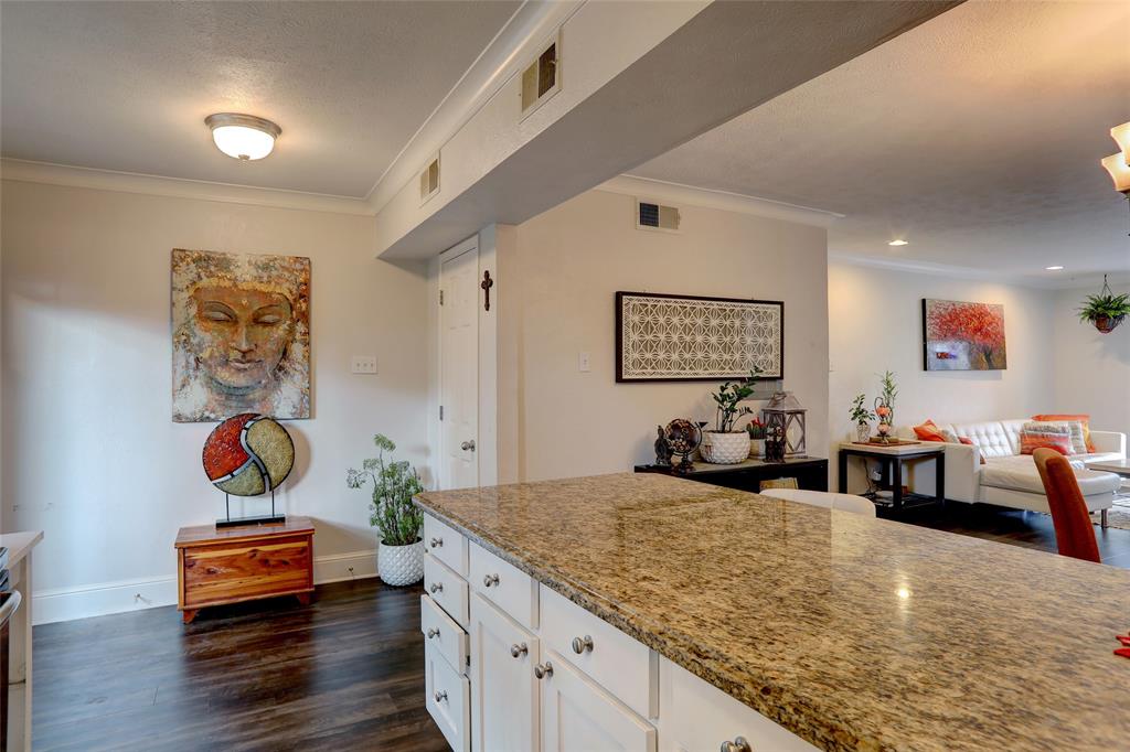 7736 Meadow Road, Unit 102 Dallas, TX 75230 - Photo 11 of 25 The full picture — living, dining, and kitchen in one easy flow