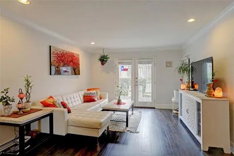 a bedroom with furniture and a wooden floor