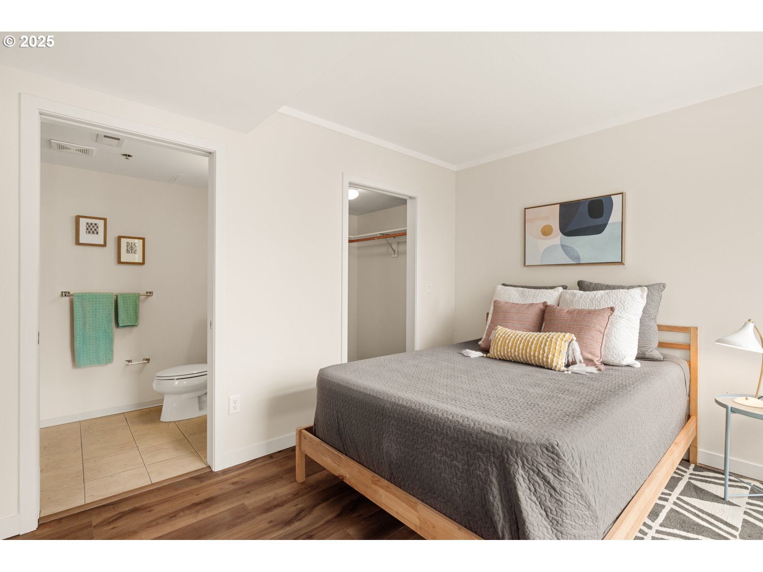 533 Northeast Holladay Street, Unit 601 Portland, OR 97232 - Photo 11 of 25 a bedroom with a bed and a view of bathroom