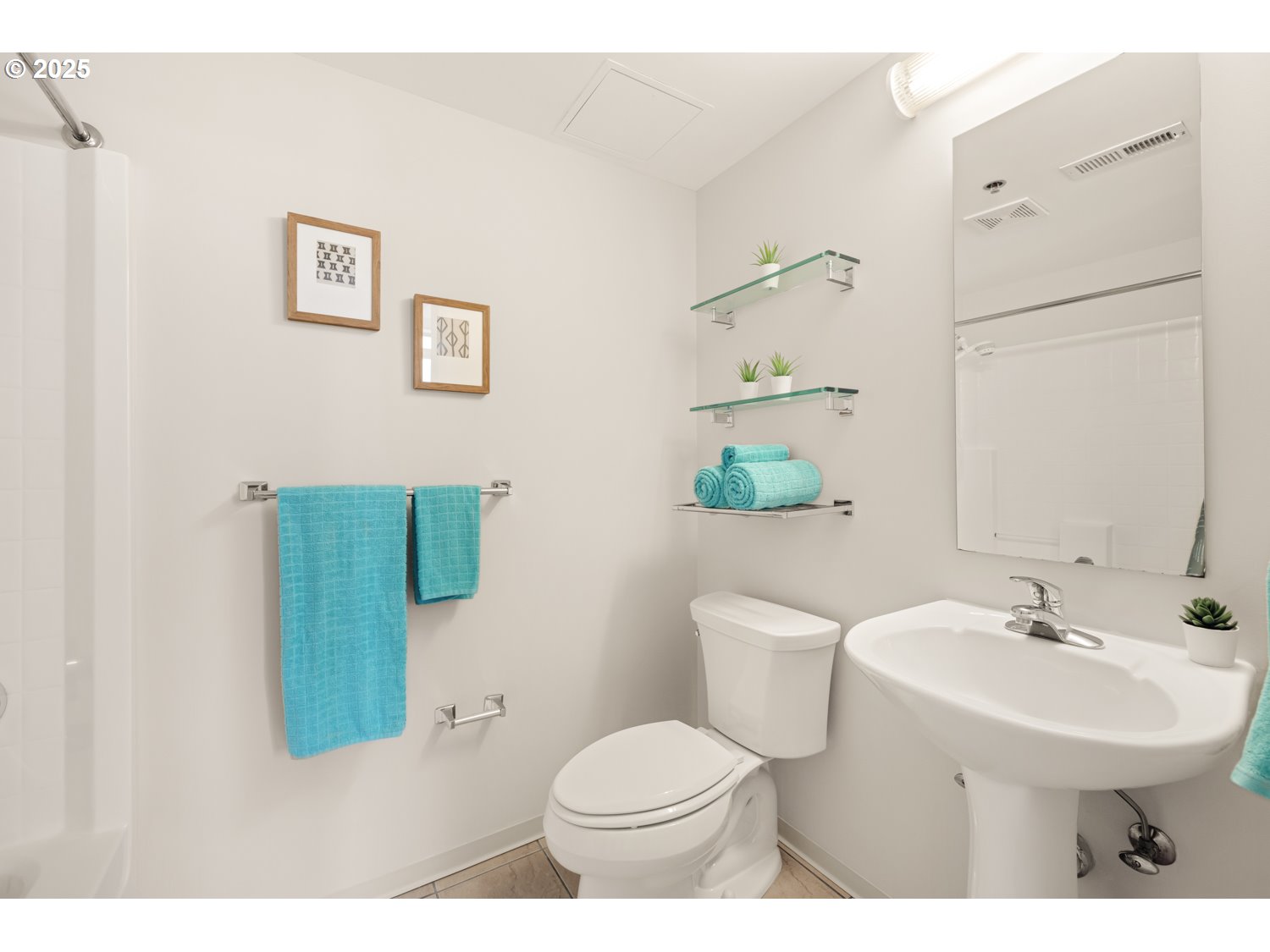 533 Northeast Holladay Street, Unit 601 Portland, OR 97232 - Photo 12 of 25 a bathroom with a sink toilet and a mirror
