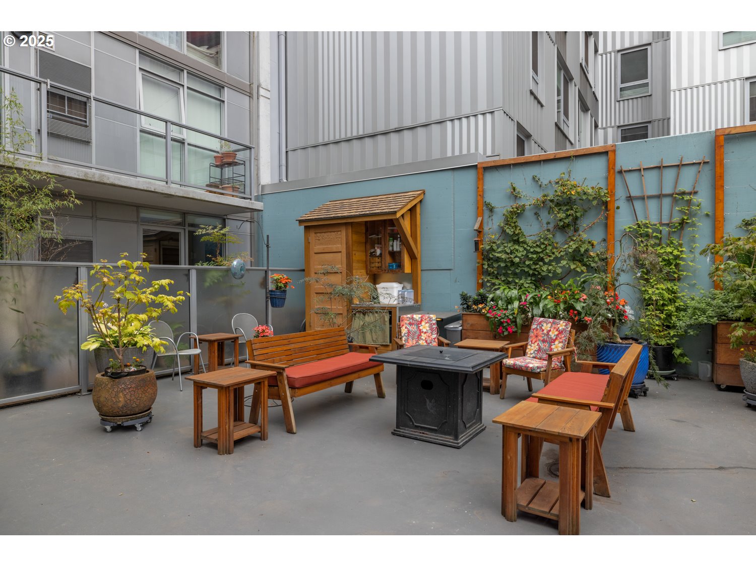 533 Northeast Holladay Street, Unit 601 Portland, OR 97232 - Photo 18 of 25 a backyard of a house with outdoor seating