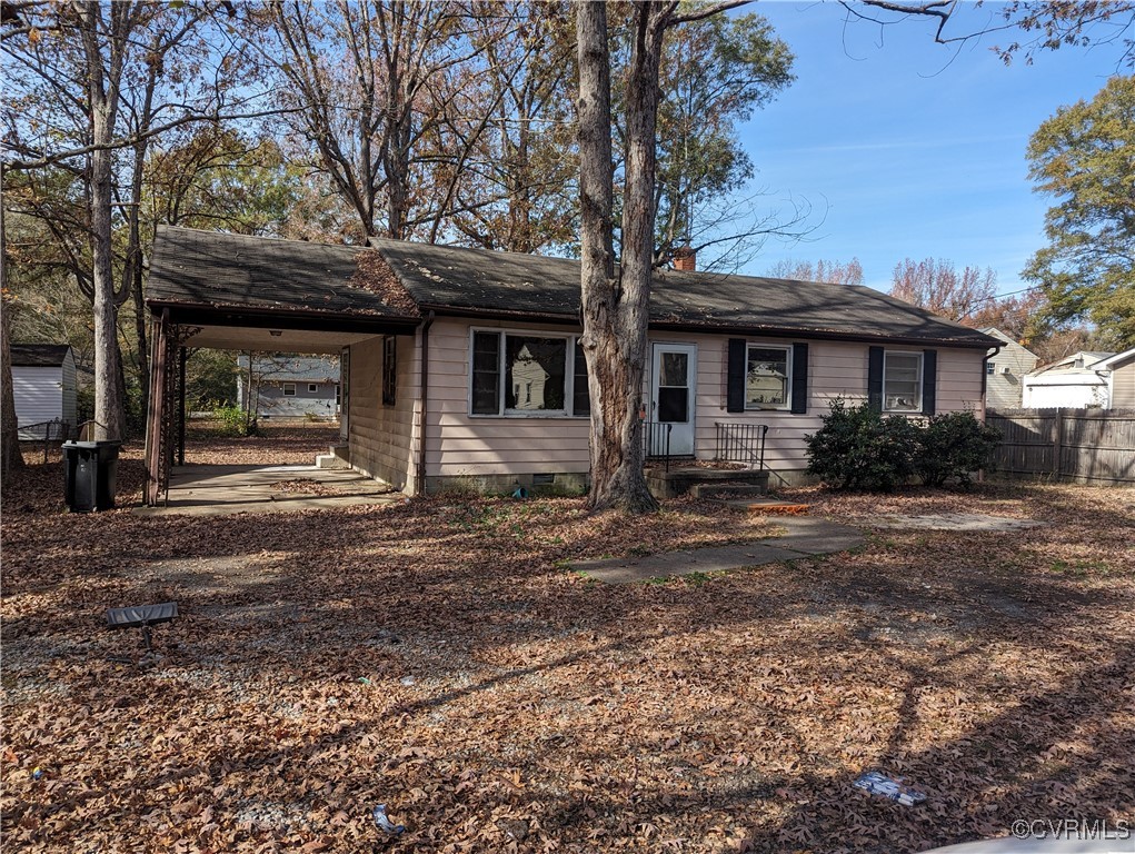 Ranch-style house with a carport