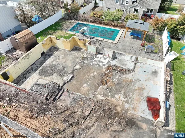 a view of yard from deck with patio