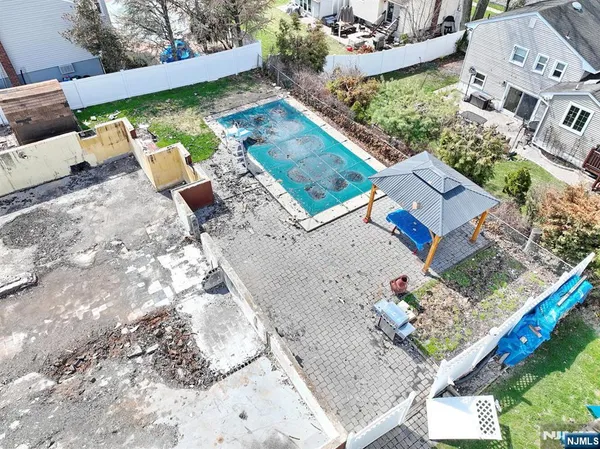 an aerial view of a house with a garden