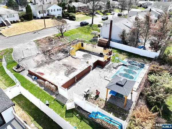 an aerial view of a house with a garden