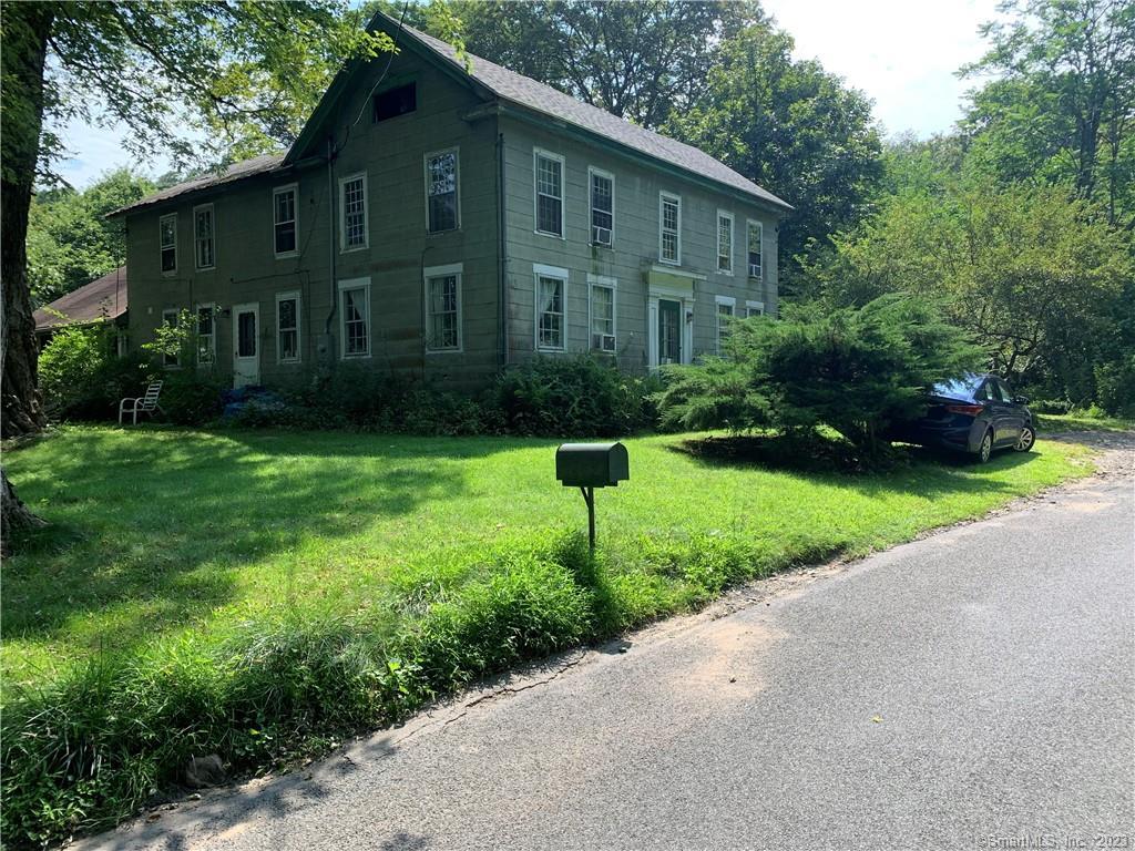 35 Hazel Plain Road Woodbury, CT 06798 - Photo 1 of 1 a front view of a house with yard and green space