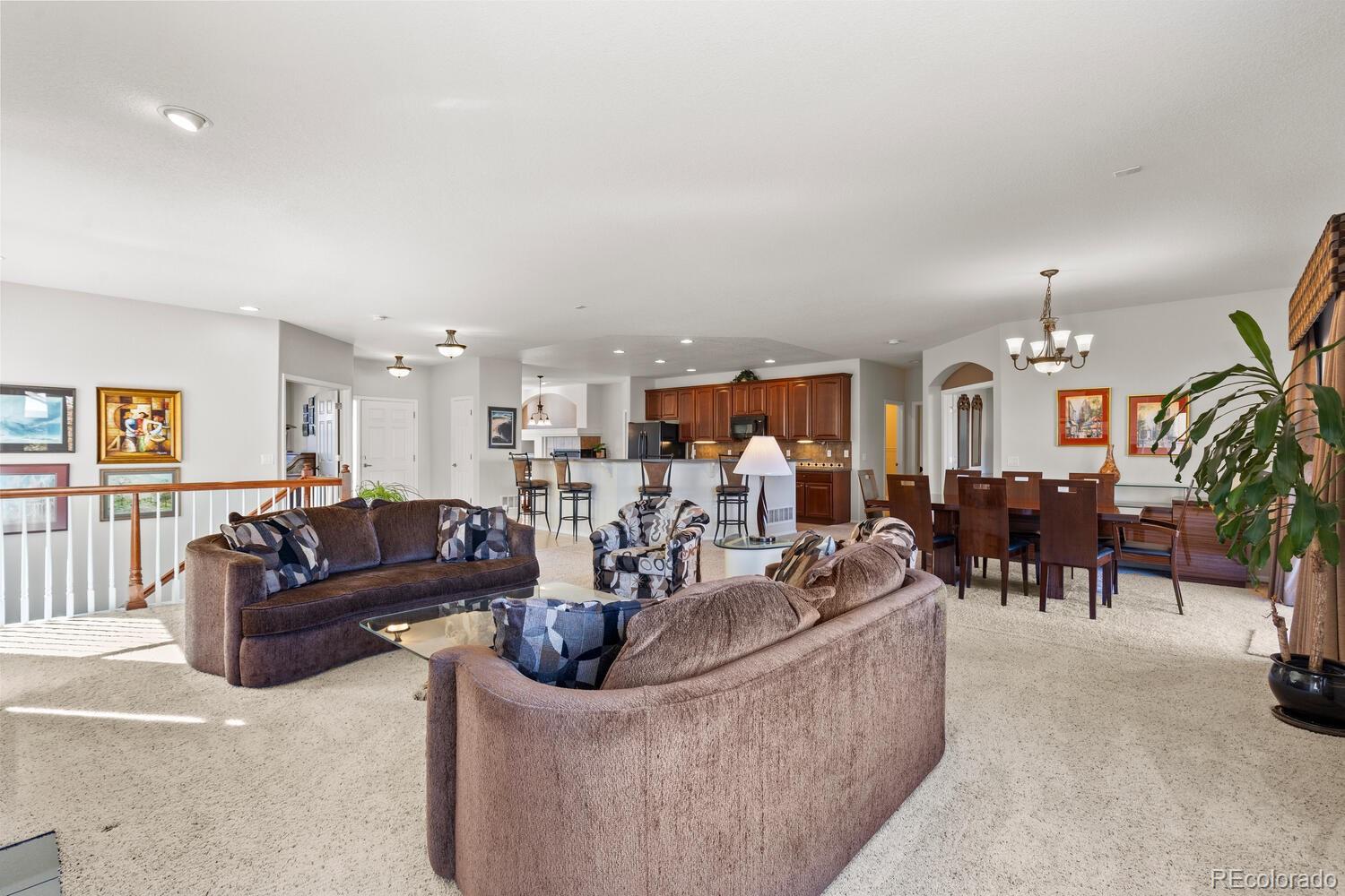 8322 South Quatar Circle Aurora, CO 80016 - Photo 18 of 47 a living room with furniture and a table
