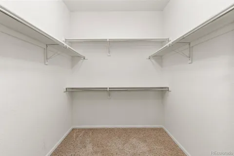 a view of an empty walk in closet