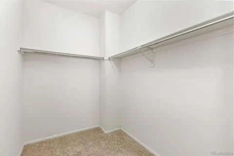a view of a room with shelf on the wall