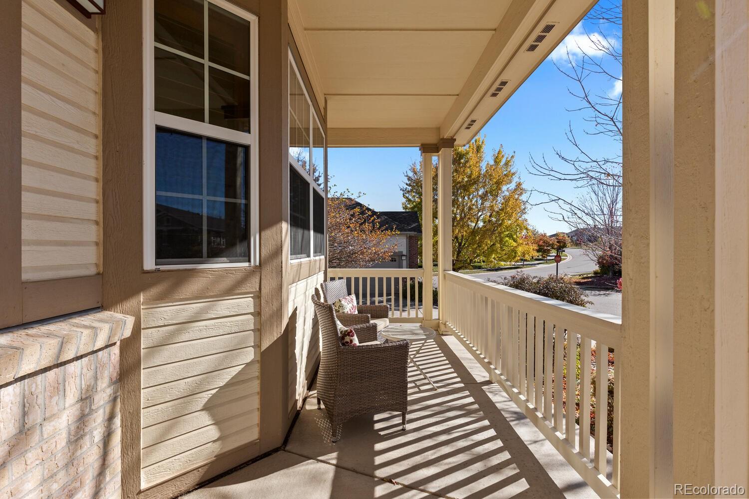 8322 South Quatar Circle Aurora, CO 80016 - Photo 3 of 47 a view of balcony with wooden floor and fence