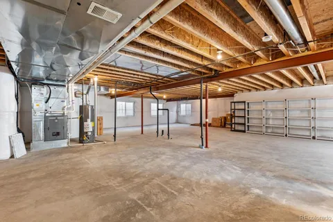 a view of empty room with white walls