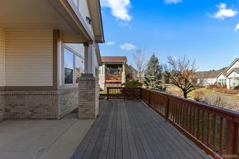 a view of a house with wooden deck