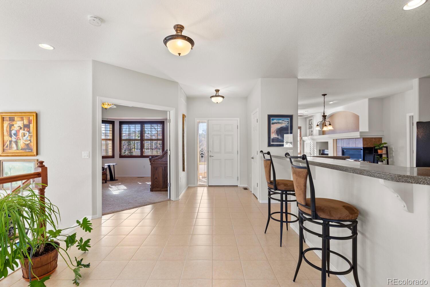 8322 South Quatar Circle Aurora, CO 80016 - Photo 4 of 47 a dining room with furniture and window