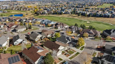an aerial view of a houses with a lake view