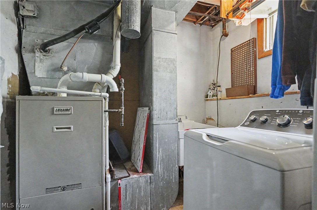 4250 Herr Fieldhouse Road Southington, OH 44470 - Photo 23 of 50 Utility space featuring a Luxaire furnace with associated plumbing and ductwork
