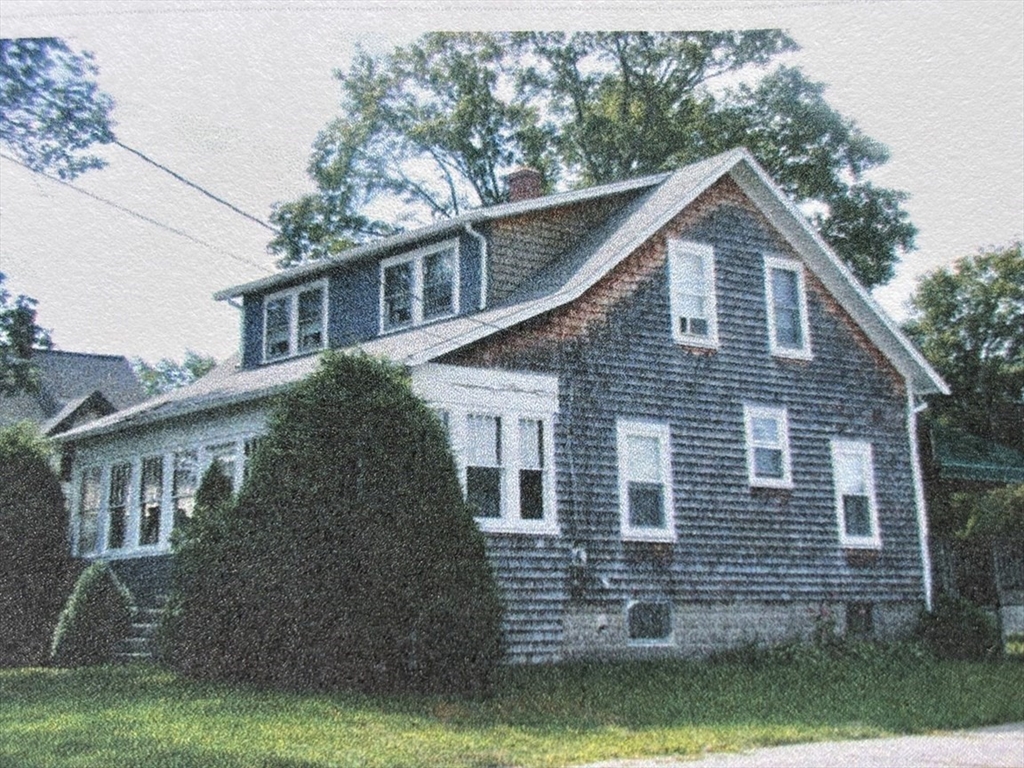577 County Street Taunton, MA 02780 - Photo 2 of 23 a front view of a house with yard