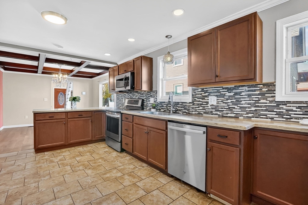 41 Florida Street Springfield, MA 01109 - Photo 13 of 41 a large kitchen with stainless steel appliances granite countertop a sink and cabinets