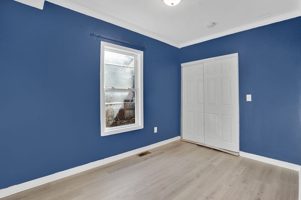 41 Florida Street Springfield, MA 01109 - Photo 21 of 41 an empty room with windows and closet
