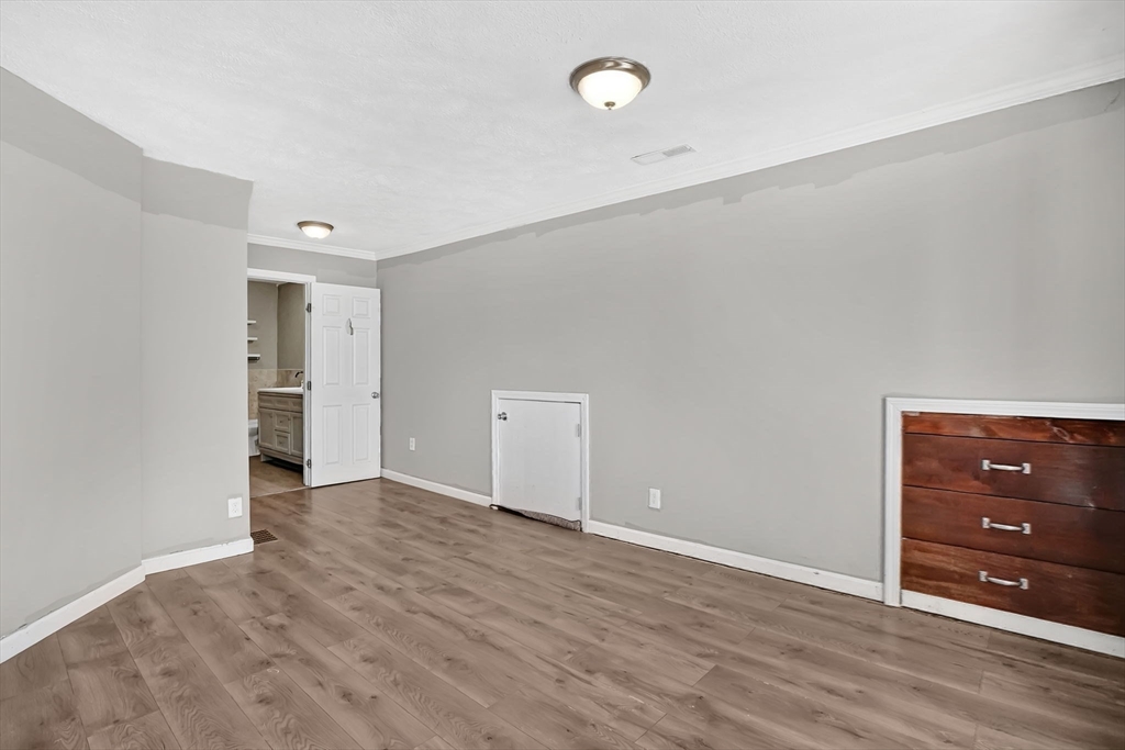 41 Florida Street Springfield, MA 01109 - Photo 23 of 41 a view of an empty room with wooden floor