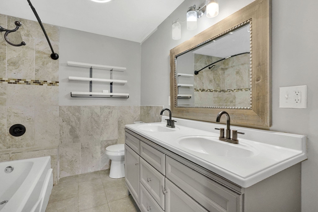 41 Florida Street Springfield, MA 01109 - Photo 26 of 41 a bathroom with a sink a toilet and shower