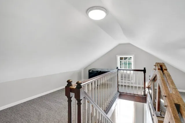a view of a hallway with stairs