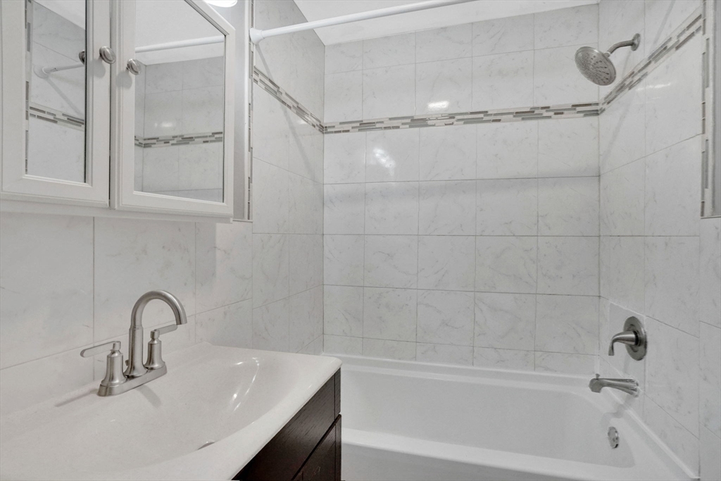 41 Florida Street Springfield, MA 01109 - Photo 35 of 41 a bathroom with a sink and a bathtub