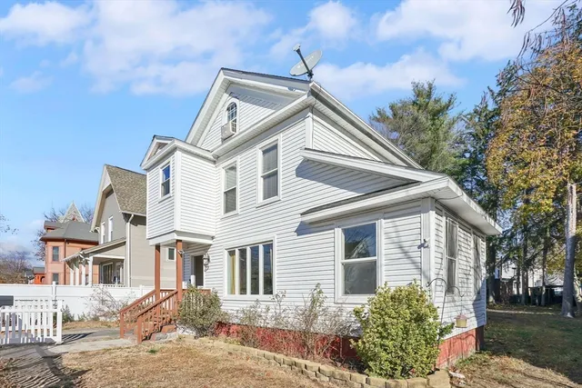 a view of a house with a yard