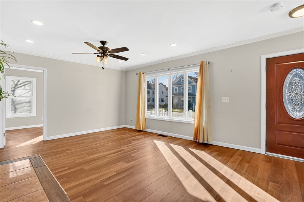 41 Florida Street Springfield, MA 01109 - Photo 6 of 41 a view of a room with a ceiling fan and window