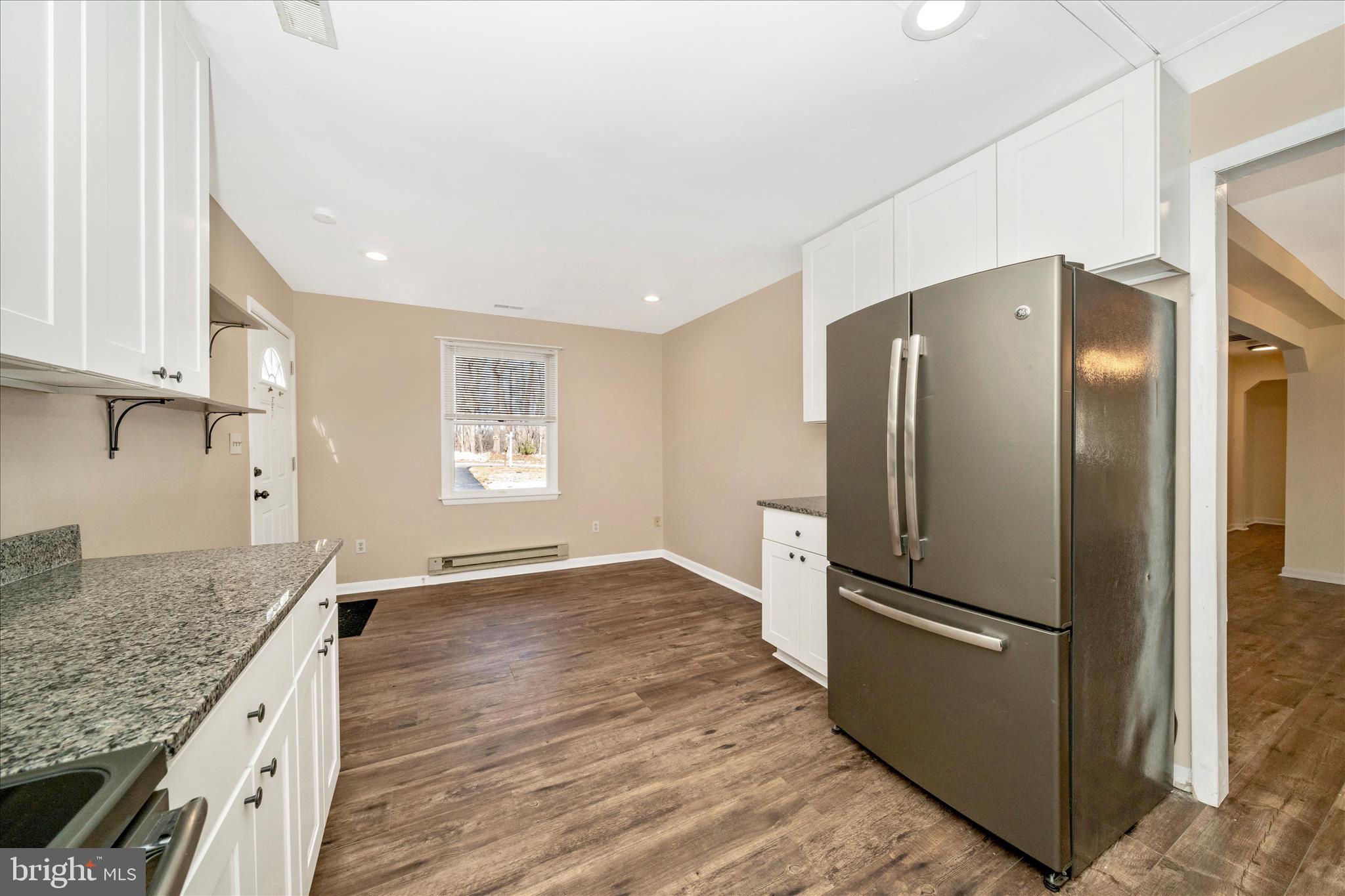 923 Klees Mill Road Westminster, MD 21157 - Photo 18 of 52 a kitchen with stainless steel appliances granite countertop a refrigerator and a sink
