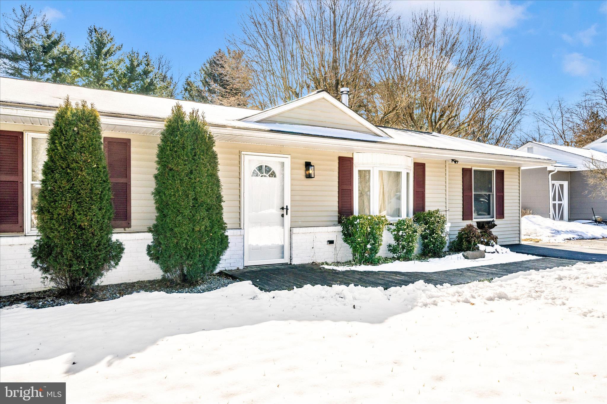 923 Klees Mill Road Westminster, MD 21157 - Photo 2 of 52 a front view of a house with a yard and potted plants