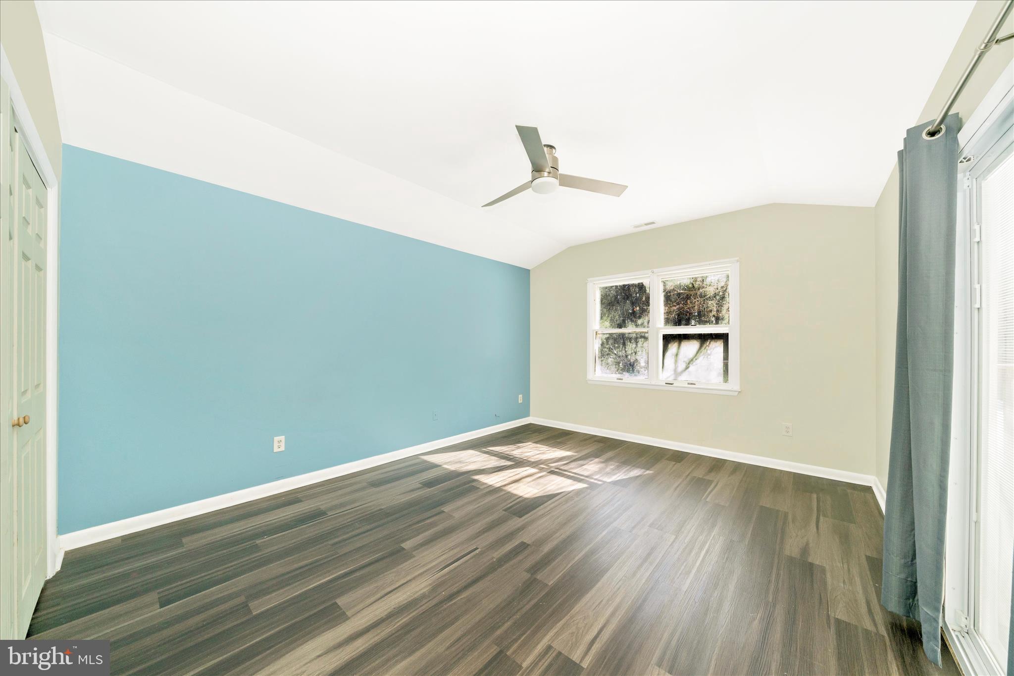 923 Klees Mill Road Westminster, MD 21157 - Photo 22 of 52 a view of empty room with wooden floor and fan