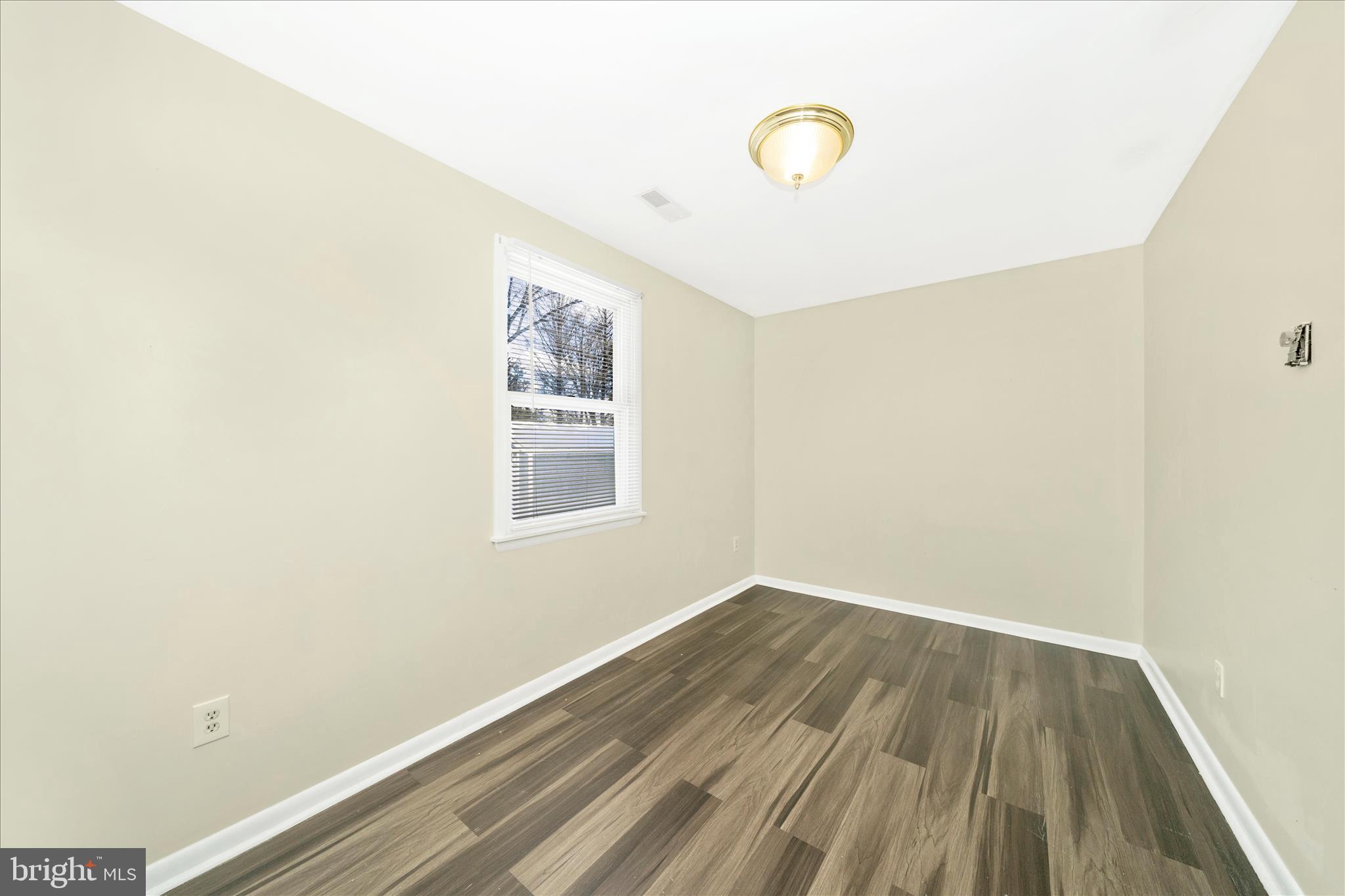 923 Klees Mill Road Westminster, MD 21157 - Photo 25 of 52 a view of a room with wooden floor and window
