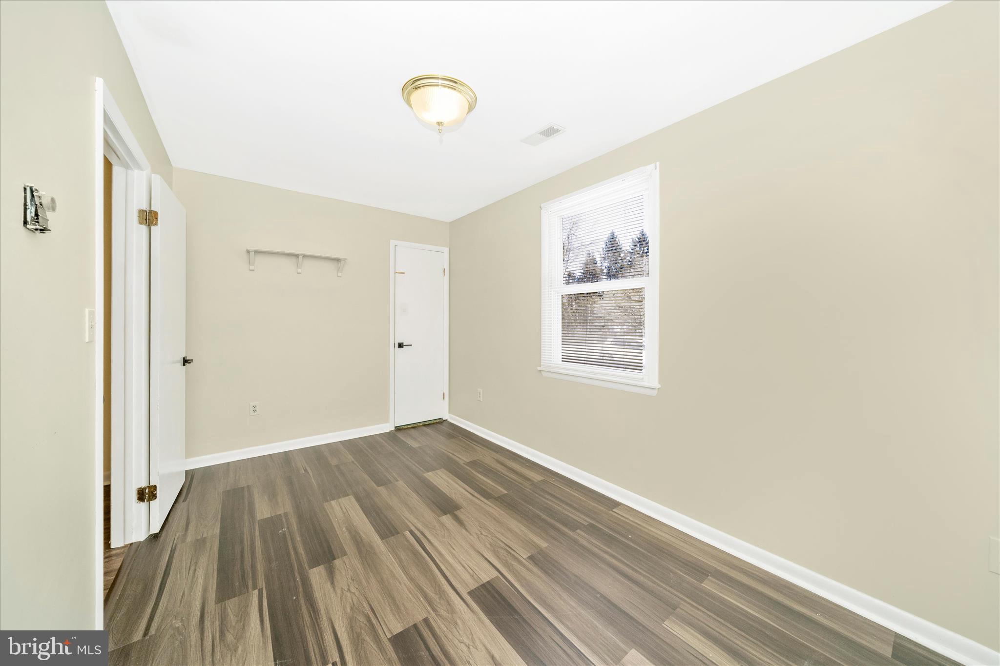 923 Klees Mill Road Westminster, MD 21157 - Photo 28 of 52 a view of a room with wooden floor and window