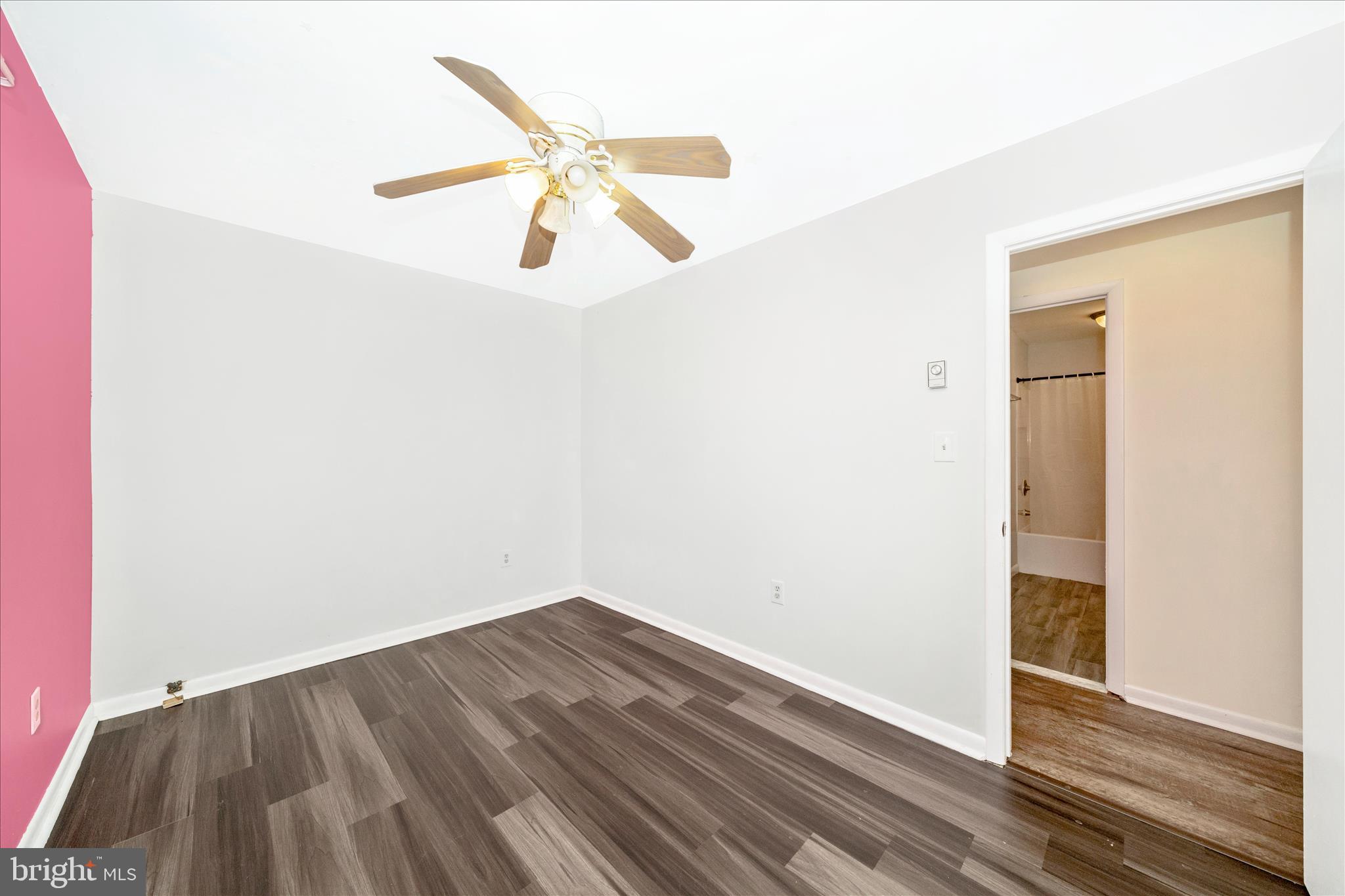 923 Klees Mill Road Westminster, MD 21157 - Photo 30 of 52 an empty room with wooden floor and windows
