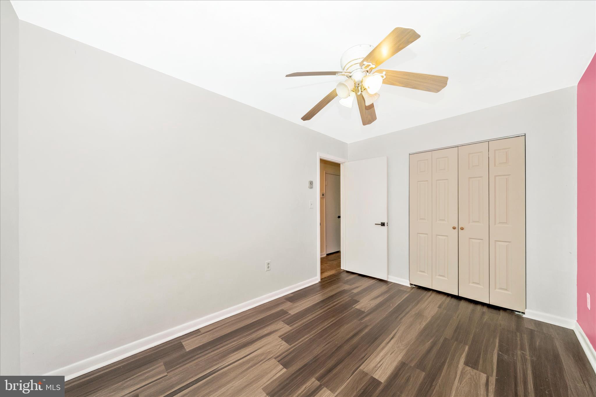 923 Klees Mill Road Westminster, MD 21157 - Photo 31 of 52 a view of a room with wooden floor and ceiling fan