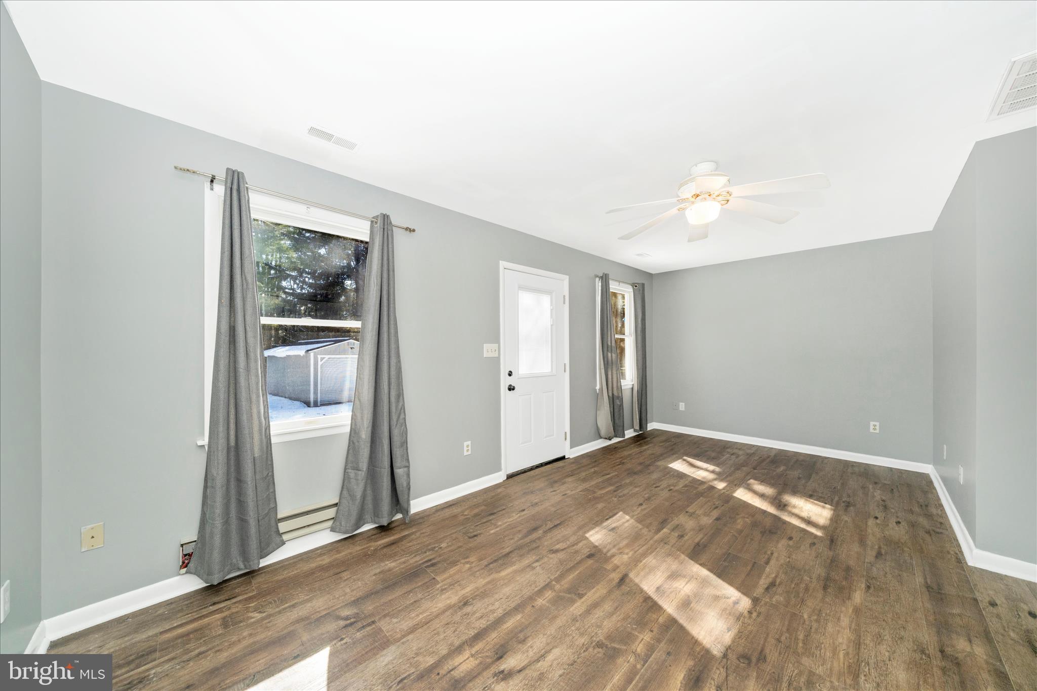 923 Klees Mill Road Westminster, MD 21157 - Photo 34 of 52 a view of empty room with wooden floor