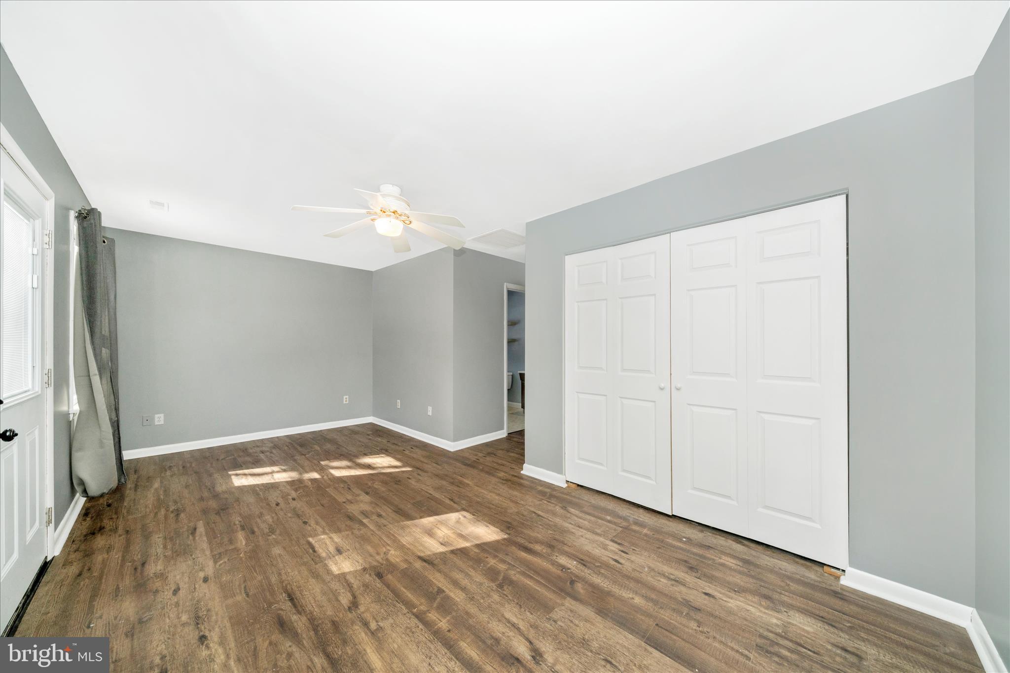 923 Klees Mill Road Westminster, MD 21157 - Photo 35 of 52 an empty room with wooden floor and window