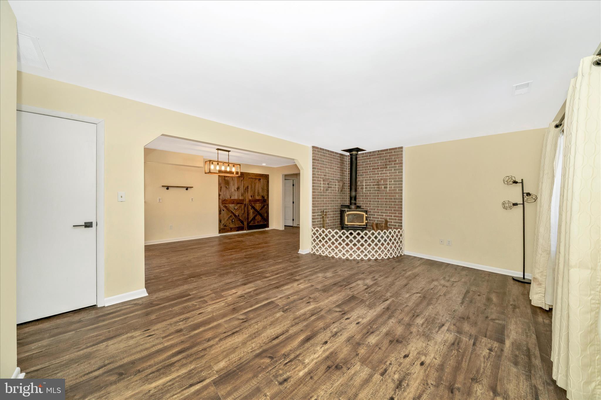 923 Klees Mill Road Westminster, MD 21157 - Photo 4 of 52 a view of a livingroom with wooden floor and a bathroom