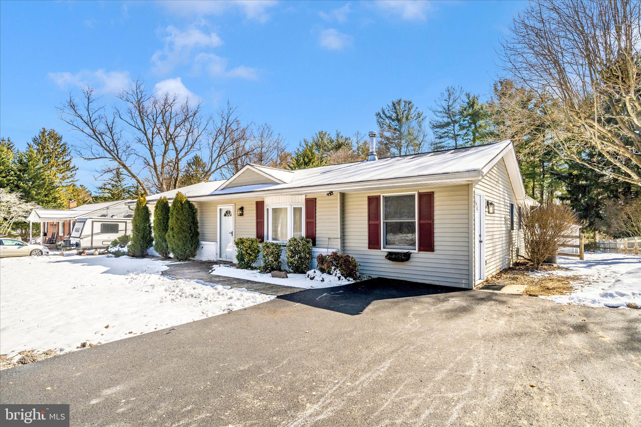 923 Klees Mill Road Westminster, MD 21157 - Photo 48 of 52 a view of a house with a yard covered with snow in the background