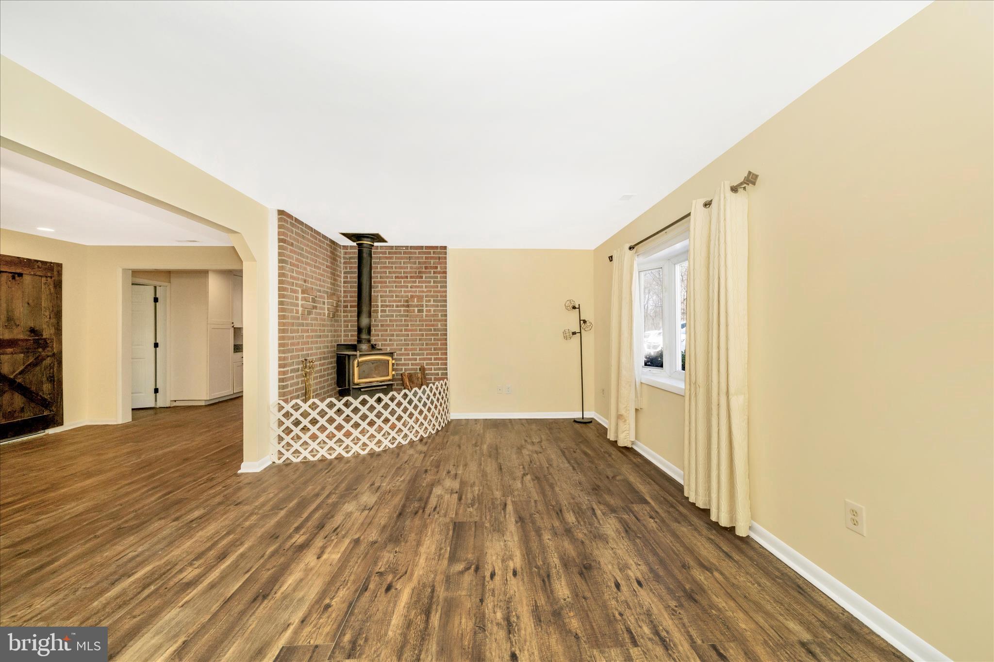 923 Klees Mill Road Westminster, MD 21157 - Photo 8 of 52 a view of a walk in closet with wooden floor