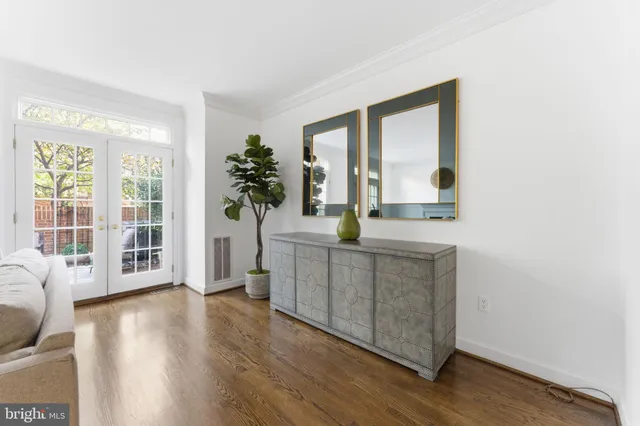 a kitchen with stainless steel appliances a refrigerator a sink a stove a microwave a center island and cabinets