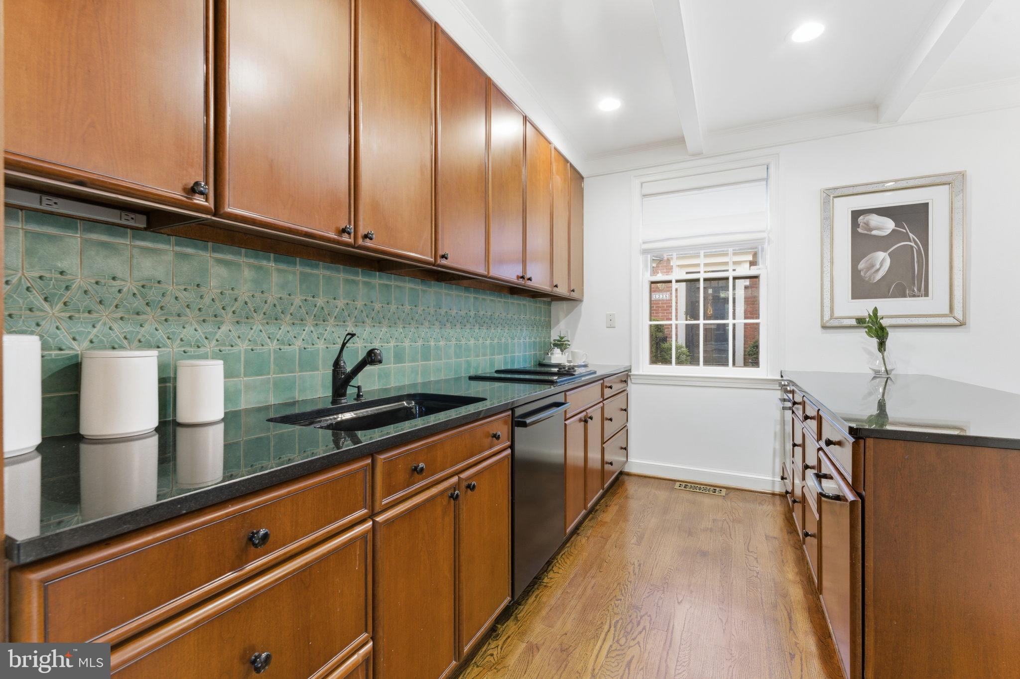 4354 Westover Place Northwest Washington, DC 20016 - Photo 20 of 63 a kitchen with stainless steel appliances granite countertop a sink stove and cabinets