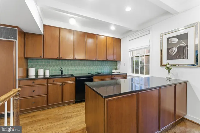 a bedroom with a bed and a wooden floor