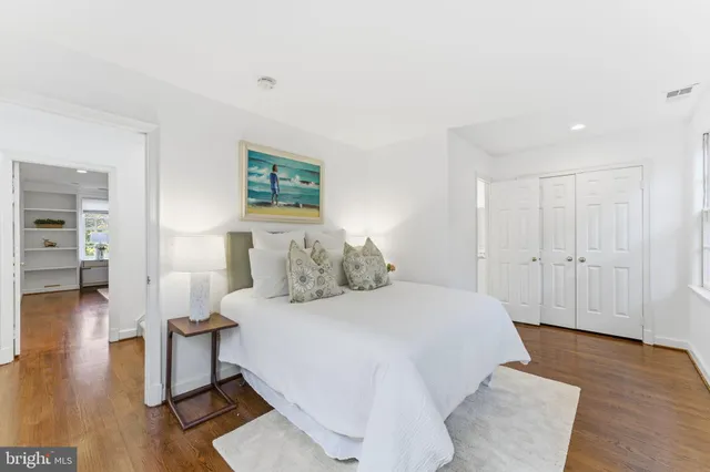 a bed room with a bed and a window