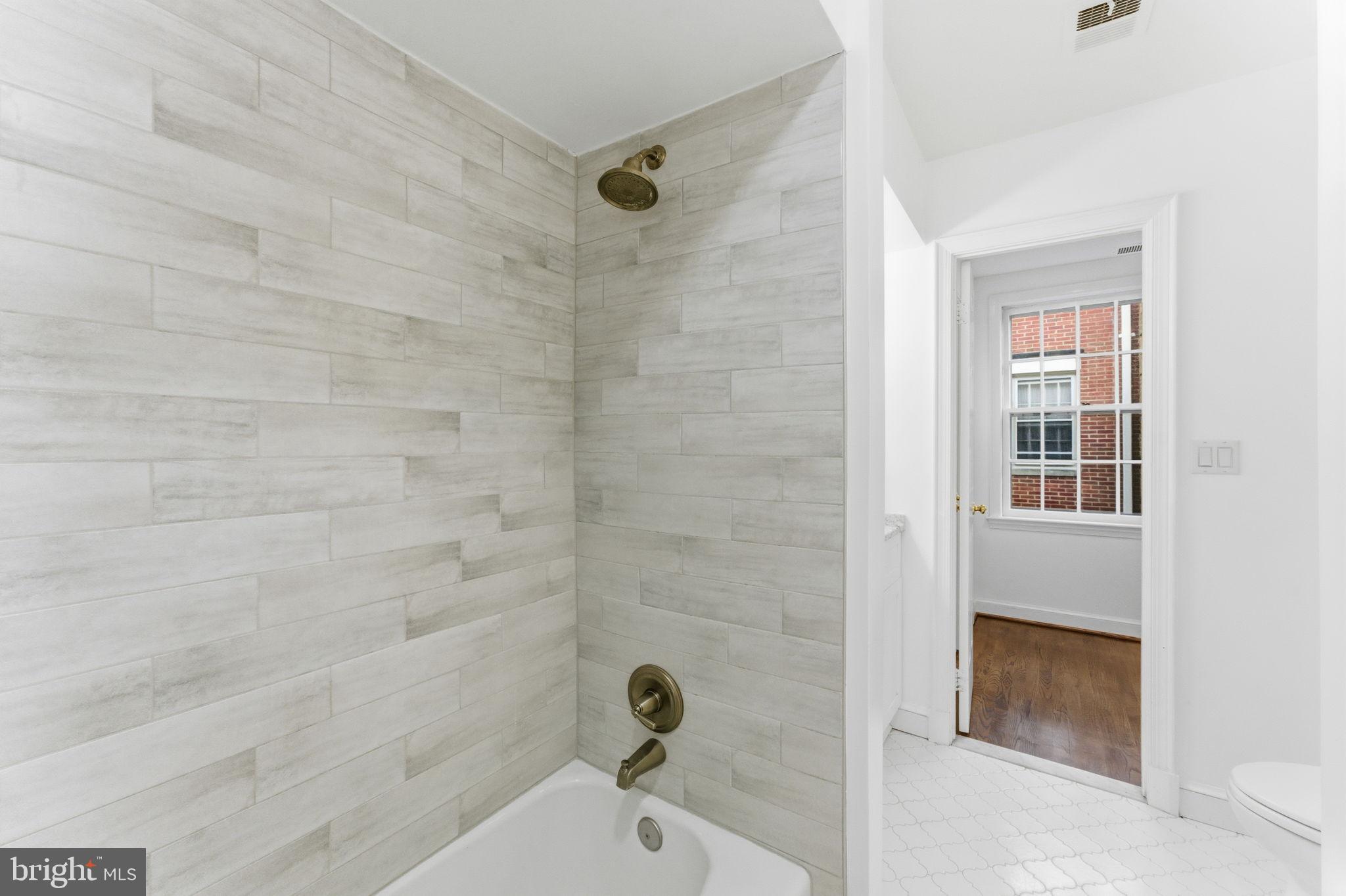 4354 Westover Place Northwest Washington, DC 20016 - Photo 36 of 63 Modern bathroom with elegant tile accents.