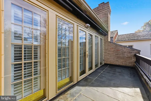a kitchen with a refrigerator sink and cabinets
