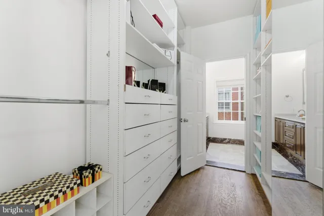 a bathroom with a mirror sink and vanity